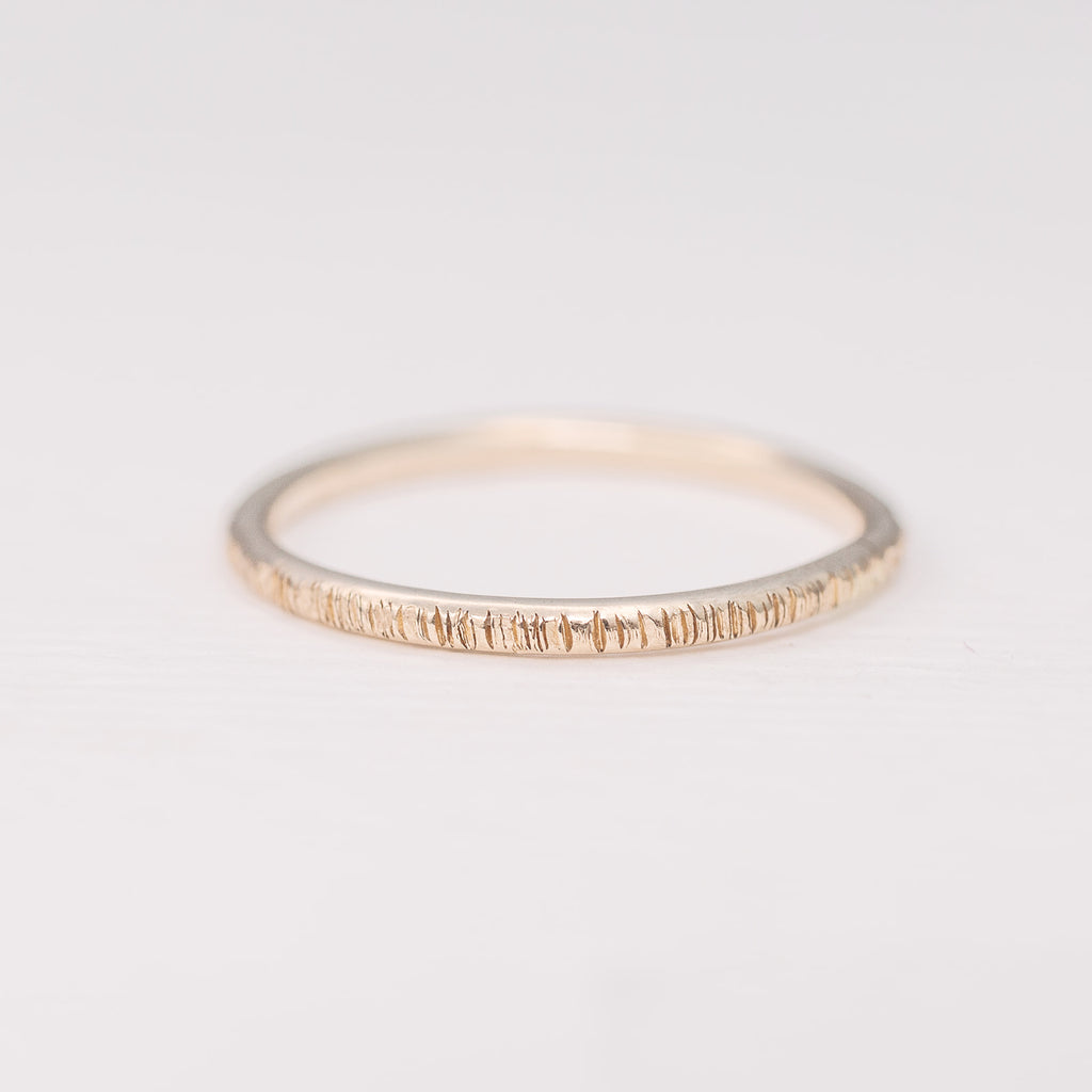 Minimalist handmade 14k solid gold stacking ring with a birch texture