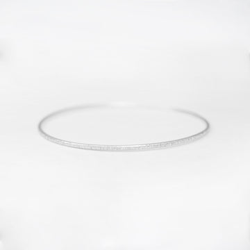 Minimalist handmade sterling silver stacking bangle in a birch texture