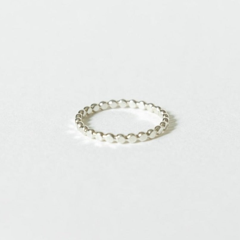 Sterling Silver beaded ring on white surface