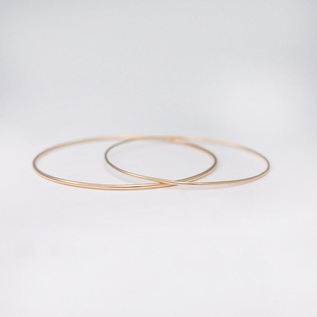 Thick and thin minimalist handmade 14k solid gold stacking bangles
