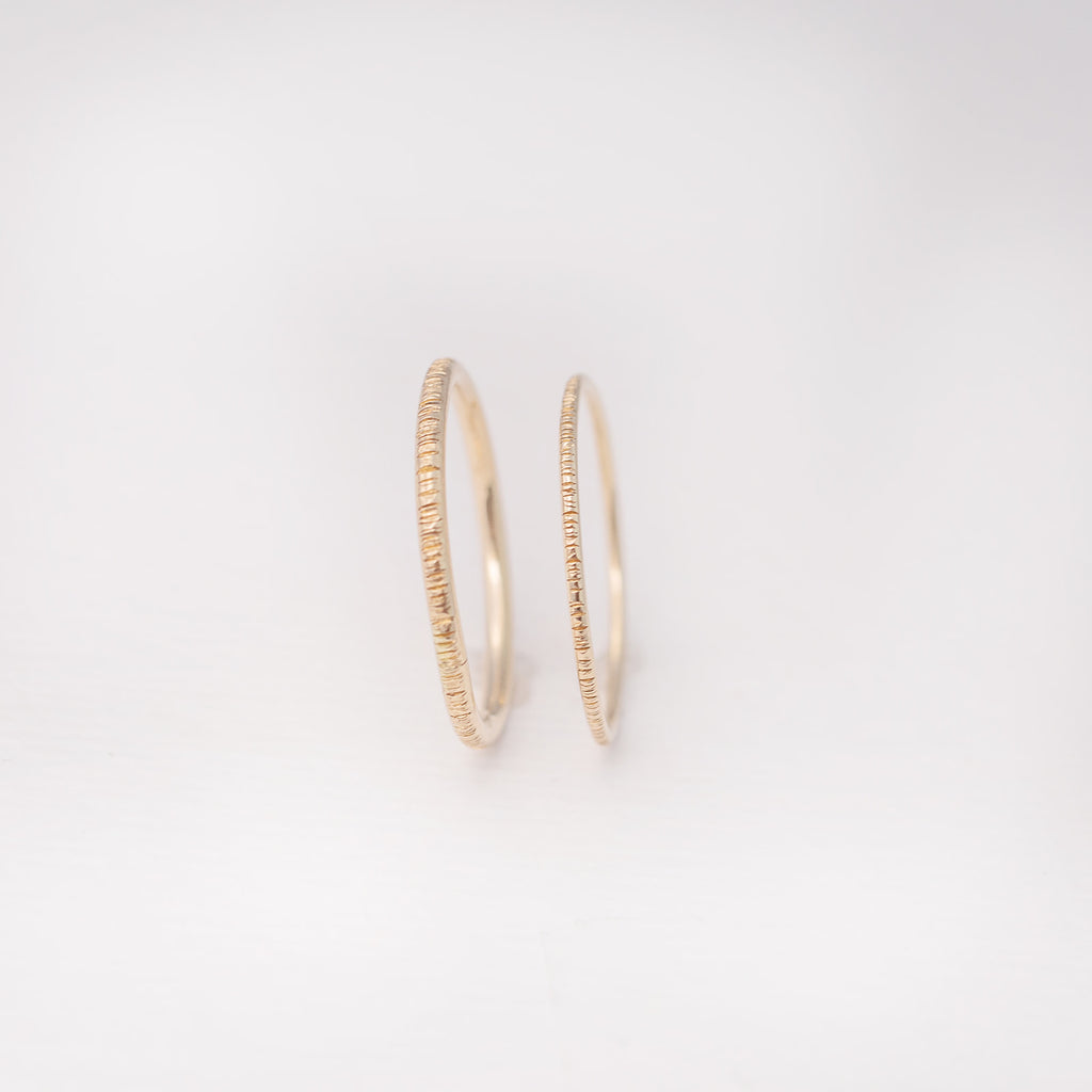 Minimalist handmade 14k solid gold stacking rings with a birch texture
