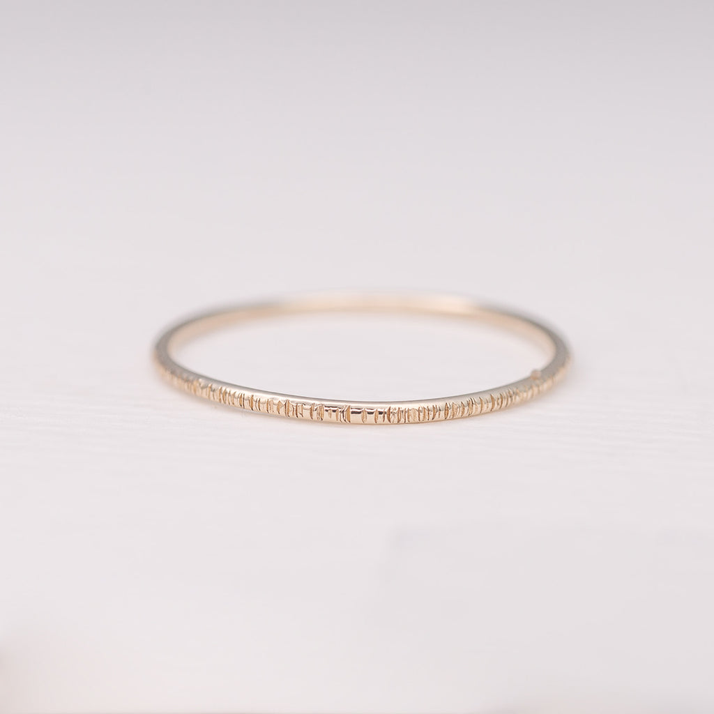 Minimalist handmade 14k solid gold stacking ring with a birch texture