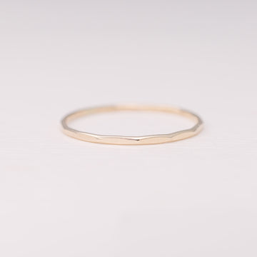 Minimalist handmade 14k solid gold stacking ring with a faceted texture