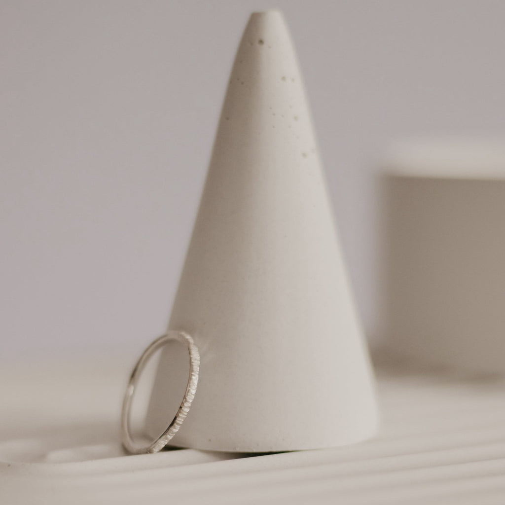 Minimalist handmade sterling silver stacking ring in a birch texture