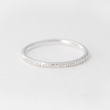 Minimalist handmade sterling silver stacking ring in a birch texture